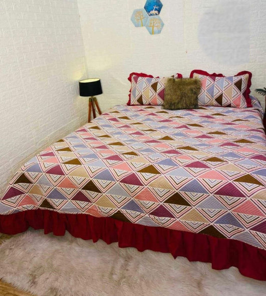 Rustic Red Printed Quilted Bedcover With Frill On The Three Bedside